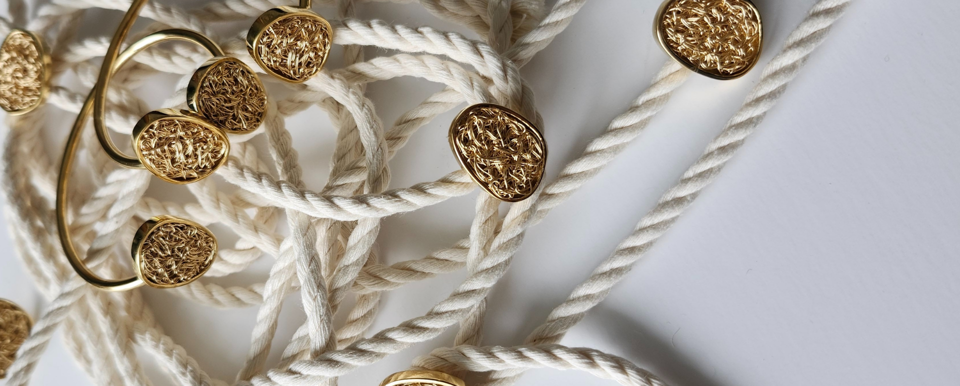 Hand made gold bracelets with crochet details