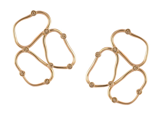 Handmade light gold earrings showcasing a unique geometric pattern.