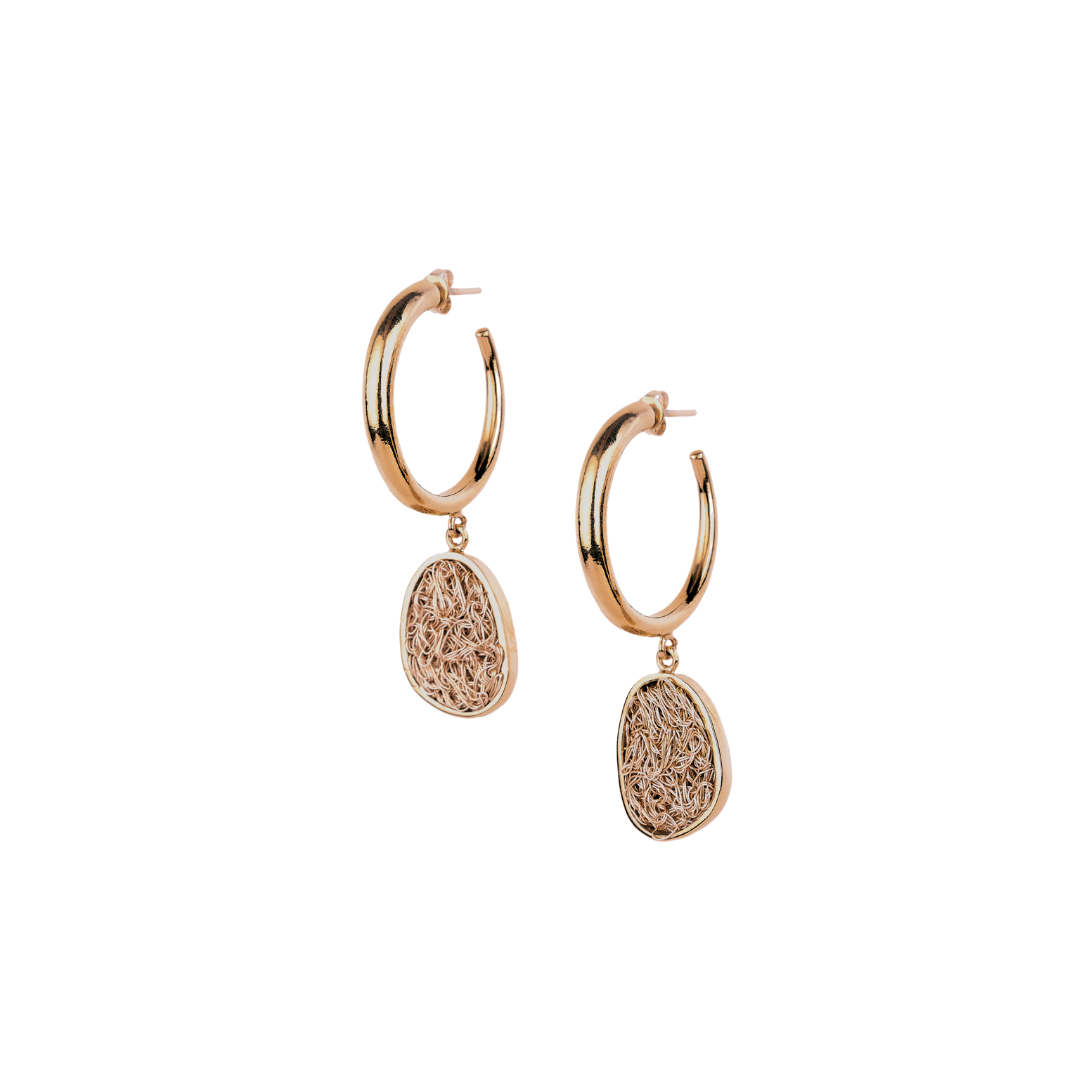 Handmade light gold hoops showcasing a unique fusion of modern aesthetics and delicate crochet craftsmanship.