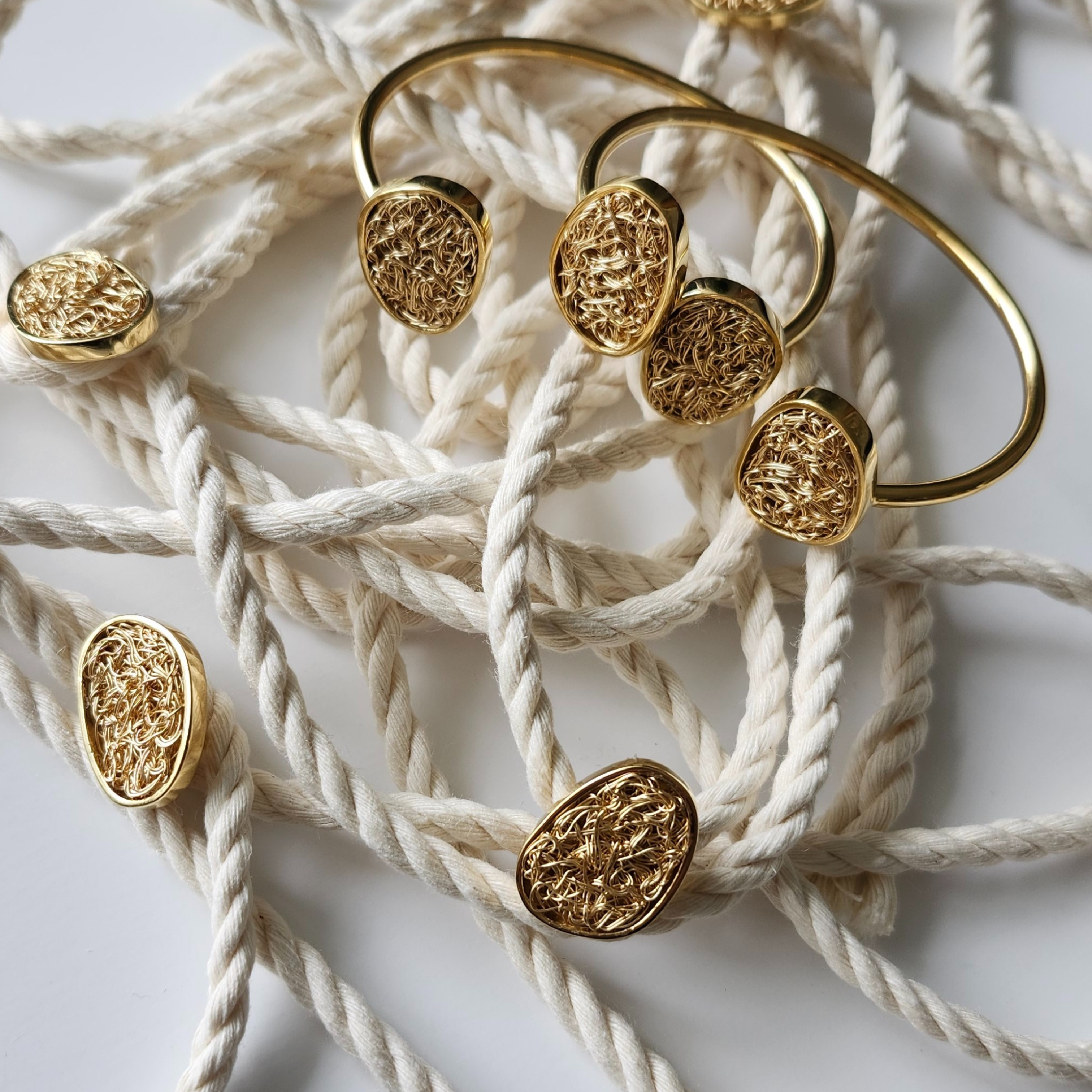 hand made gold bangle bracelets with crochet details
