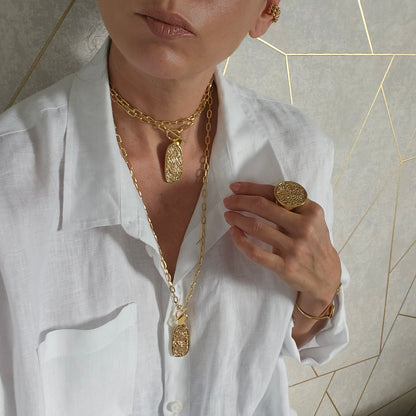 Artisan-crafted gold necklace with a distinctive and modern design, perfect for bold statements.